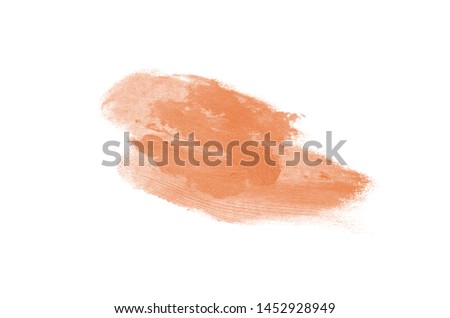 Smear and texture of lipstick or acrylic paint isolated on white background. Stroke of lipgloss or liquid nail polish swatch smudge sample. Element for beauty cosmetic design. Orange color