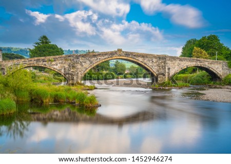 Stone bridge across the river Conwy, at Llanrwst, Caernarfon, North Wales Royalty-Free Stock Photo #1452946274