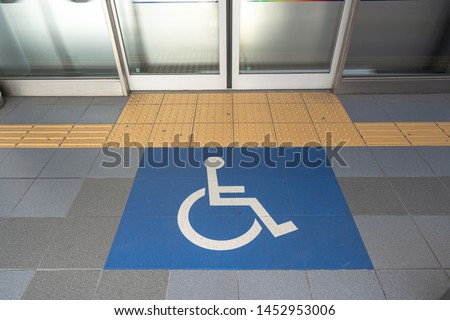 Disable wheelchair sign in public transportation at the floor to enter the train in Japan, important and care of disable in developed country.