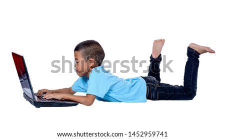 Cute little Asian girl child lying on the floor studying or using laptop isolated on white background with clipping path. Kids and education concept