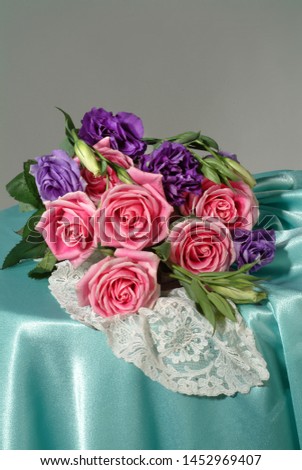 Bouquet of flowers on a fabric studio background