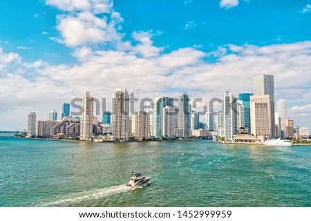 Business district Miami. Richness concept. Architecturally impressive high rise towers. Skyscrapers and harbor. Must see attractions. Miami waterfront lined with marinas. Downtown Miami city center.