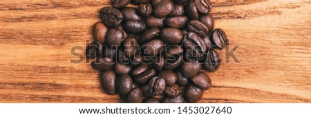 A cup of coffee and scattered coffee beans. Layout. Flat lay. Coffee bean.