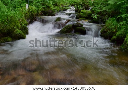 Open Shutter Slow Speed Waterfall In Woods Photo