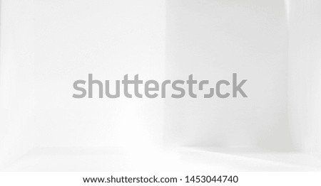 Light and shadow in the backdrop of an open white room with space