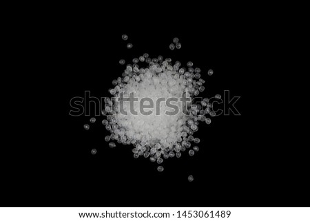 Concept Natural plastics Love the world. Polymer pellets Isolated on black background. Innovation natural plastic.