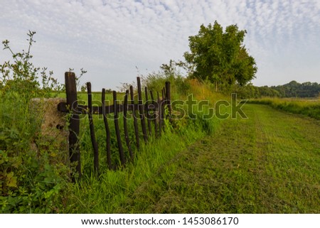 grass path with wooden door