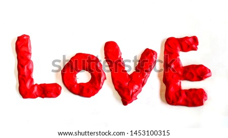 Plasticine clay modeling texts. Love lettering. Concept for valentine's day. Isolated on white background.