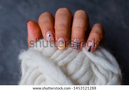 perfect nails design with geometric pattern. Females hands with manicure. cozy nails design.