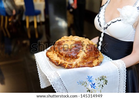 girl serving loaf in restaurant