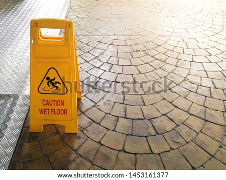 Caution wet floor sign on the floor with copy space.