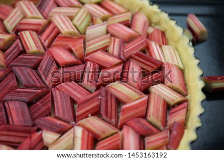 closeup shot of rhubarb pie in gathered in geometrical order.