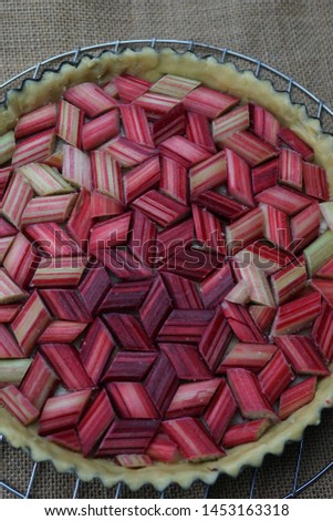 closeup shot of rhubarb pie in gathered in geometrical order.