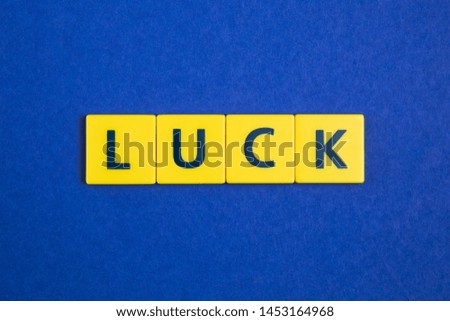 Luck word on yellow tiles