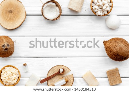 Organic cosmetics with coconut oil on white wooden background top view mockup