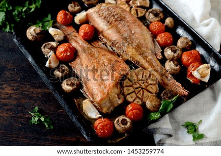 Baked sea bass with vegetables and herbs