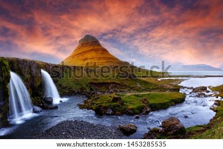 Majestic Kirkjufell volcano the coast of Snaefellsnes peninsula. Picturesque and gorgeous scene. Kirkjufellsfoss, Iceland, sightseeing Europe. Amazing picture of the popular tourist attraction.