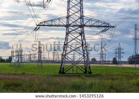 Group silhouette of transmission towers power tower, electricity pylon, steel lattice tower . Texture high voltage pillar, overhead power line.