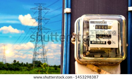 Electric meter for use in home appliances, behind high voltage towers, electric power concepts and electricity usage