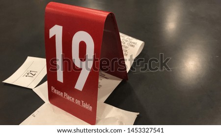 Ordering number on a table at a restaurant