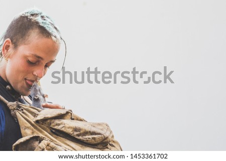 LifeStyle Photography. Punk Girl portrait kissing a mouse