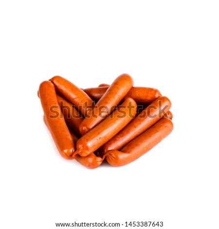 Smoked sausages in natural casing brown color on white background