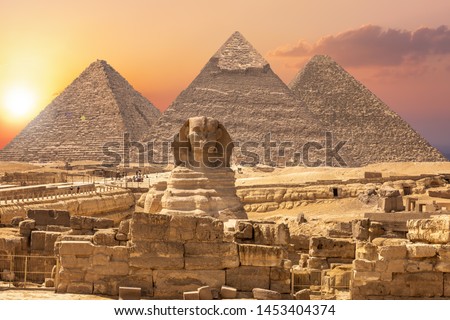 The Sphinx and the Piramids, famous Wonder of the World, Giza, Egypt Royalty-Free Stock Photo #1453404374