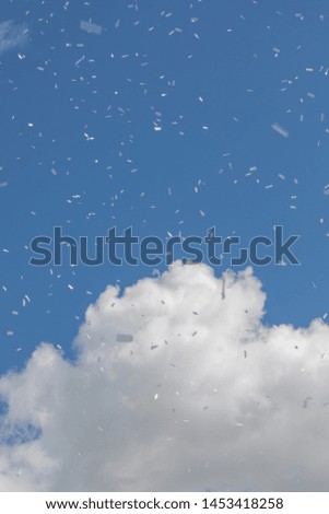Blue sky woth confetti and clouds