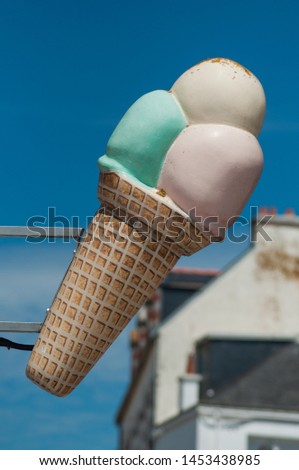 closeup of ice cream sign in the street
