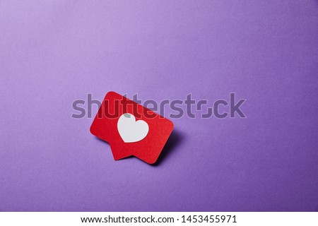 card with like sign on purple surface