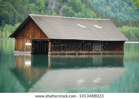 Almost sunken boatshouse on lake Almsee in Upper Austria Royalty-Free Stock Photo #1453488023