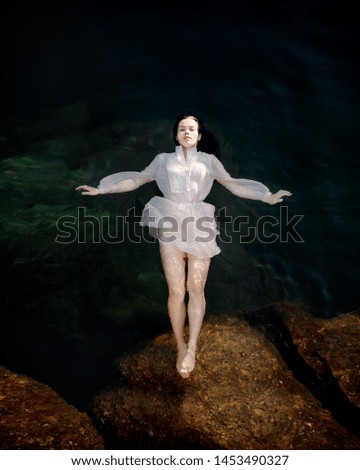 Young woman swimming in lake Stock Image