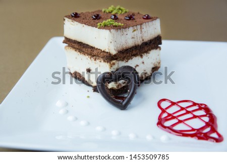 Sweets on a plate with chocolate, sugar, nuts