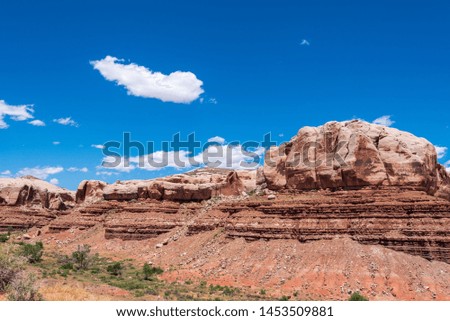 Landscape of massive boulders or rock formations against the sky in Bluff, Utah