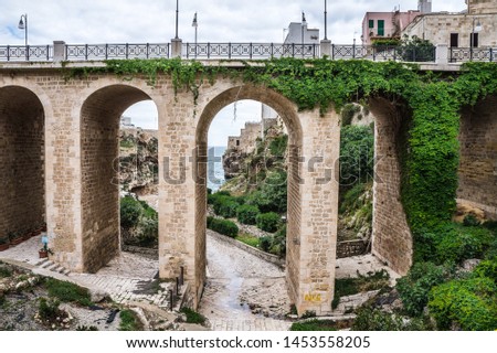 Italian city of Polignano a Mare, Puglia Italy, bridge Royalty-Free Stock Photo #1453558205