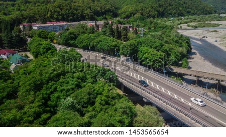 Aerial view of traffic on bridge, 2 lane road with cars