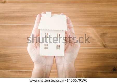 Home idea in human hand dream to sweet family