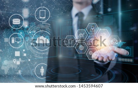 Manager Technical Industrial Engineer working and control robotics with monitoring system software and icon industry network connection on tablet. AI, Artificial Intelligence, Automation robot arm.
