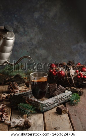 Christmas hot glass of coffee on a wooden table. Copy space