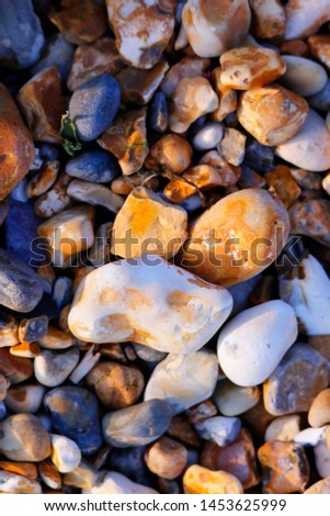 Full frame of pebbles at the beach.