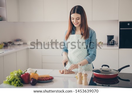 Photo of attractive house wife making perfect supper for family cut hen meat for new recipe dish