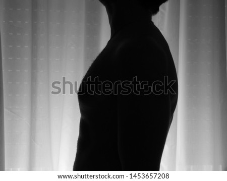 Silhoutte of a man standing in the dark