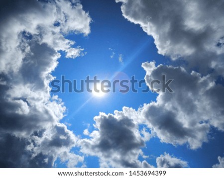 Beautiful photo of the sky with the sun and big white clouds