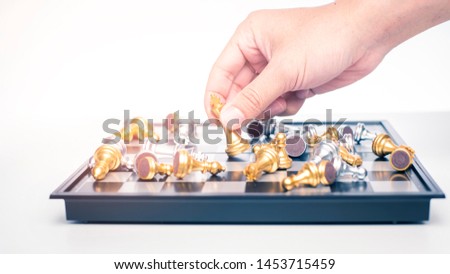 Close up of Business man is playing chess, business management strategy concept 