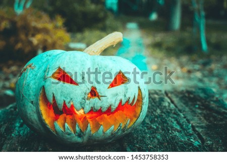 scary pumpkin for Halloween in autumn