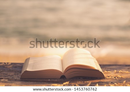 Bible on the wooden floor to pray most High God Style tone yellow gold Royalty-Free Stock Photo #1453760762