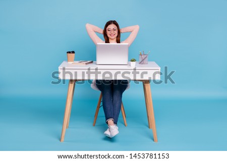 Portrait of nice lovely attractive cheerful cheery girl sitting in chair daily everyday task hr manager human resources at work place station isolated over bright vivid shine blue green background Royalty-Free Stock Photo #1453781153