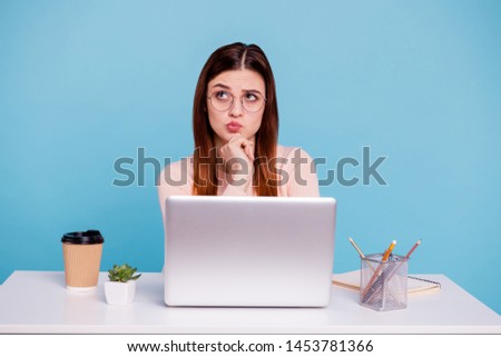 Close up photo beautiful she her foxy lady sit desk office workplace workstation not sure doubtful deep thinking look up empty space wear casual pastel warm pullover isolated bright blue background