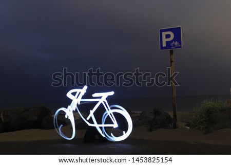 Night photography lightpainting drawing bicycle