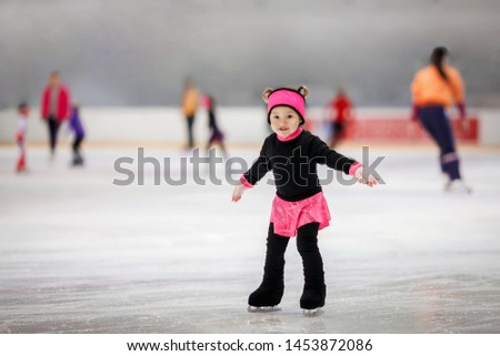 Cute girl learns to skate